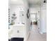 Bathroom with a single vanity and a view of a bedroom through a doorway at 3611 Marisol Ct, New Smyrna Beach, FL 32168