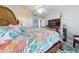 Spacious bedroom featuring a four-poster bed, ceiling fan, and stylish tropical decor at 3611 Marisol Ct, New Smyrna Beach, FL 32168