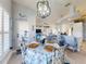 Bright dining area features a decorative chandelier and view of the updated kitchen at 3611 Marisol Ct, New Smyrna Beach, FL 32168