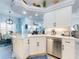 Bright kitchen with granite countertops, stainless appliances, and crisp white cabinets at 3611 Marisol Ct, New Smyrna Beach, FL 32168