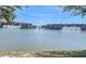 Beautiful lake view featuring buildings and water fountains on a sunny day at 3611 Marisol Ct, New Smyrna Beach, FL 32168