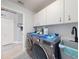 Well-organized laundry room featuring modern appliances and ample storage space at 3611 Marisol Ct, New Smyrna Beach, FL 32168