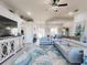 Bright, open-concept living room featuring stylish decor and seamless flow to dining and kitchen areas at 3611 Marisol Ct, New Smyrna Beach, FL 32168