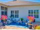 Outdoor patio featuring a cozy seating area with plush cushions and views of the backyard at 3611 Marisol Ct, New Smyrna Beach, FL 32168