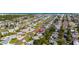 An aerial view shows the neighborhood layout and the home's position on a tree lined street at 38 Seacrest Dr, Ormond Beach, FL 32176