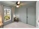 This cozy bedroom is painted a relaxing light green and offers plenty of natural light at 38 Seacrest Dr, Ormond Beach, FL 32176
