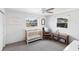 Bright bedroom with a crib, rocking chair, and natural light from the windows at 38 Seacrest Dr, Ormond Beach, FL 32176