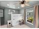 This cozy bedroom is painted a relaxing light green and offers plenty of natural light at 38 Seacrest Dr, Ormond Beach, FL 32176