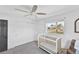 Comfortable bedroom with crib, closet, and bright natural light at 38 Seacrest Dr, Ormond Beach, FL 32176