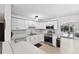 Bright kitchen featuring white cabinets and stainless steel appliances at 38 Seacrest Dr, Ormond Beach, FL 32176