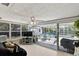 Relaxing sunroom with a ceiling fan and sliding glass doors leading to an outdoor patio area at 38 Seacrest Dr, Ormond Beach, FL 32176