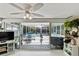 Bright sunroom with access to a screened-in patio featuring an outdoor dining set at 38 Seacrest Dr, Ormond Beach, FL 32176