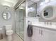 Updated bathroom featuring a glass shower, modern fixtures, and neutral gray tones at 403 Wildwood Dr, Edgewater, FL 32132
