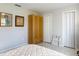 This bedroom features a double door closet, additional closet, and tiled floors at 403 Wildwood Dr, Edgewater, FL 32132