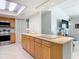 Spacious kitchen with granite countertops, stainless steel appliances, and wood cabinetry at 403 Wildwood Dr, Edgewater, FL 32132