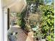 Brick pathway borders lush garden, complementing the home's exterior at 403 Wildwood Dr, Edgewater, FL 32132