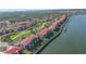 Stunning aerial view of waterfront condos, showcasing its prime location and desirable community features at 407 Bouchelle Dr # 205, New Smyrna Beach, FL 32169