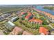 Aerial view of waterfront condos, featuring meticulously landscaped grounds, offering luxury community living at 407 Bouchelle Dr # 205, New Smyrna Beach, FL 32169