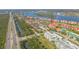 This image showcases a charming waterfront community, lush landscaping, and proximity to the highway at 407 Bouchelle Dr # 205, New Smyrna Beach, FL 32169