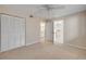 Bright, neutral bedroom with a walk-in closet and en-suite bathroom, offering ample storage and convenience at 407 Bouchelle Dr # 205, New Smyrna Beach, FL 32169