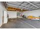 A two-car garage provides additional storage with exposed ceiling and walls at 407 Bouchelle Dr # 205, New Smyrna Beach, FL 32169
