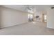 Spacious living room with carpet flooring, a dining area, and access to the kitchen at 407 Bouchelle Dr # 205, New Smyrna Beach, FL 32169