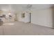 Spacious living area with bar seating and a combination of carpet and neutral paint at 407 Bouchelle Dr # 205, New Smyrna Beach, FL 32169