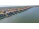 Panoramic aerial view of a waterfront community with boat slips and boardwalk at 407 Bouchelle Dr # 205, New Smyrna Beach, FL 32169
