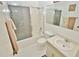 Bright bathroom featuring a shower-tub combo, sleek toilet, and large mirror over the vanity at 4225 S Atlantic Ave # 2070, New Smyrna Beach, FL 32169