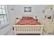 Bright bedroom with a comfortable bed, dresser, and scenic artwork at 4225 S Atlantic Ave # 2070, New Smyrna Beach, FL 32169