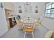 Bright dining area featuring a round table with seating for four and chandelier lighting at 4225 S Atlantic Ave # 2070, New Smyrna Beach, FL 32169