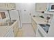 Efficient kitchen with white appliances and ample counter space at 4225 S Atlantic Ave # 2070, New Smyrna Beach, FL 32169