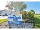 Colony Beach Club sign with palm tree and well maintained landscaping at 4225 S Atlantic Ave # 2070, New Smyrna Beach, FL 32169