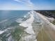 Aerial view of a sandy beach with the ocean, and condos along the coastline at 4225 S Atlantic Ave # 2150, New Smyrna Beach, FL 32169