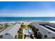 Aerial view showcasing the pool and buildings with beach access and ocean view at 4225 S Atlantic Ave # 2150, New Smyrna Beach, FL 32169