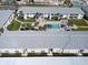 Aerial view of condos with a central pool area and well-maintained green spaces at 4225 S Atlantic Ave # 2150, New Smyrna Beach, FL 32169