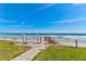 Beautiful beach access pathway with outdoor shower, leading to a serene beach at 4225 S Atlantic Ave # 2150, New Smyrna Beach, FL 32169