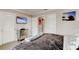 Bedroom featuring a tufted headboard, TV, and wood floors at 4225 S Atlantic Ave # 2150, New Smyrna Beach, FL 32169