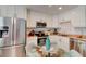 Modern kitchen features stainless steel appliances and ample white cabinetry at 4225 S Atlantic Ave # 2150, New Smyrna Beach, FL 32169