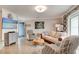 Bright living room features stylish furnishings and a large flat-screen TV at 4225 S Atlantic Ave # 2150, New Smyrna Beach, FL 32169
