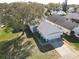 Home featuring an attached garage and well-kept lawn and landscaping, showing curb appeal and functionality at 4583 Barnacle Dr, Port Orange, FL 32127