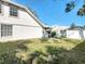 Backyard featuring a white fence and view of neighboring houses at 4583 Barnacle Dr, Port Orange, FL 32127