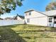 Backyard featuring a white fence and view of neighboring houses at 4583 Barnacle Dr, Port Orange, FL 32127