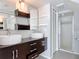 Bathroom features a double sink vanity with modern fixtures and a glass enclosed shower at 4583 Barnacle Dr, Port Orange, FL 32127