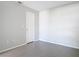 Cozy bedroom featuring grey tile flooring, base trim, and white walls at 4583 Barnacle Dr, Port Orange, FL 32127