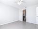 This bedroom features tile floors and easy access to the ensuite bathroom at 4583 Barnacle Dr, Port Orange, FL 32127