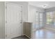 Bright entryway with neutral walls, ceramic tile flooring, and access to adjacent rooms at 4583 Barnacle Dr, Port Orange, FL 32127