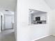 This is an overview of the kitchen area featuring white cabinets and stainless steel appliances at 4583 Barnacle Dr, Port Orange, FL 32127