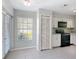 Bright eat-in kitchen featuring appliances, tile flooring, and natural light at 4583 Barnacle Dr, Port Orange, FL 32127