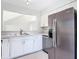Well-appointed kitchen boasting stainless steel appliances, tile flooring, and lots of counter space at 4583 Barnacle Dr, Port Orange, FL 32127